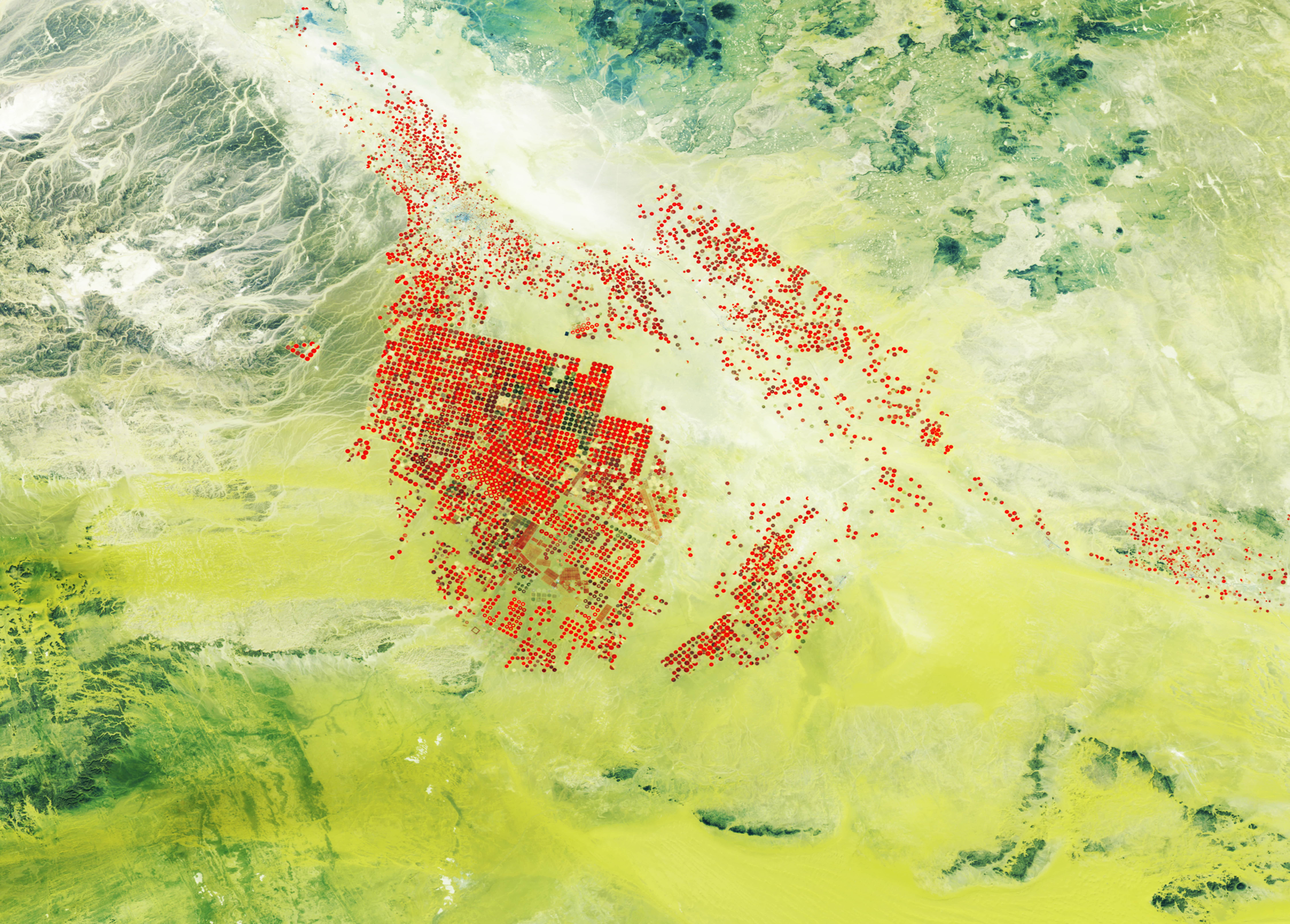 PROBA-V 100 m image of modern agricultural fields with centre-pivot irrigation (in red) and consumption of underground water resources in the Wadi As Sirhan basin of Saudi Arabia